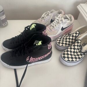 Nike Black and Pink Animal Print Sneakers, checkered vans, and Nike Air Max